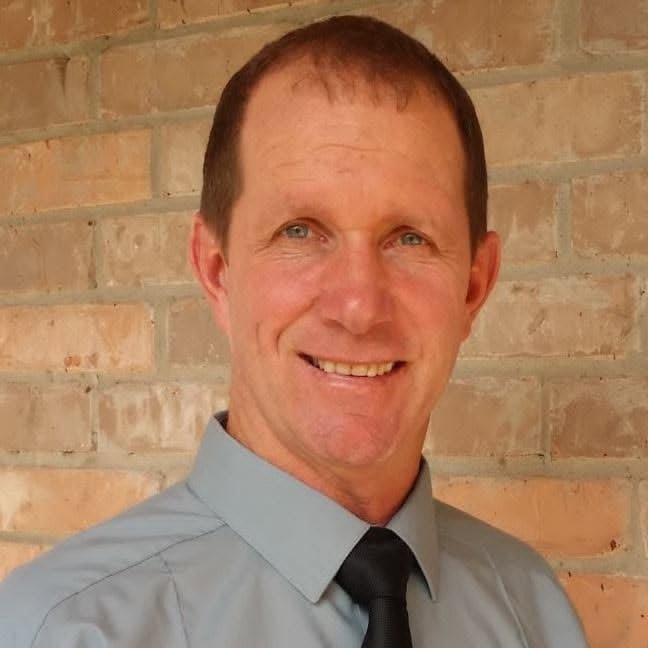Darryl, founder and carpenter at Clever Carpentry LLC, smiling in a portrait photo